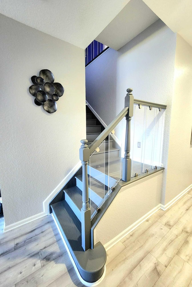 2247 SW Cape Cod Dr, Port Saint Lucie, FL 34953 - stairs featuring wood finished floors and a textured wall