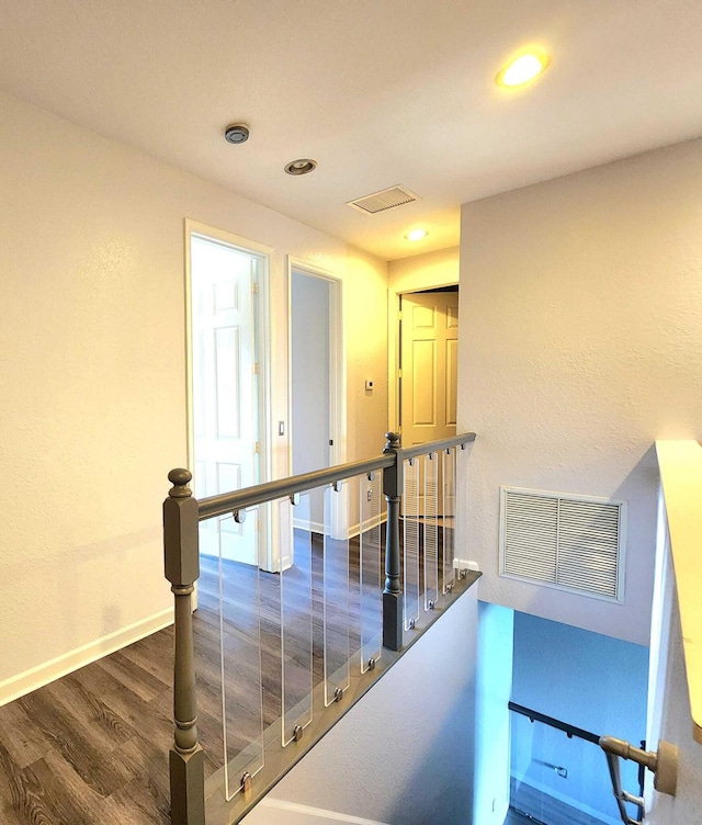 2247 SW Cape Cod Dr, Port Saint Lucie, FL 34953 - hall with an upstairs landing, wood finished floors, and recessed lighting