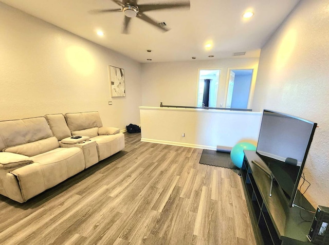 2247 SW Cape Cod Dr, Port Saint Lucie, FL 34953 - living area with a ceiling fan, light wood finished floors, and recessed lighting