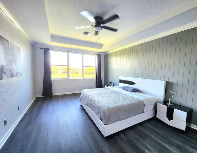 2247 SW Cape Cod Dr, Port Saint Lucie, FL 34953 - bedroom featuring dark wood finished floors, a tray ceiling, a textured ceiling, crown molding, and ceiling fan