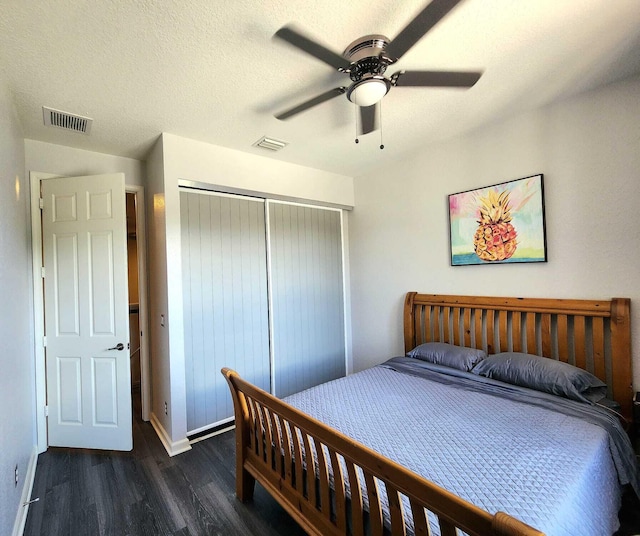 2247 SW Cape Cod Dr, Port Saint Lucie, FL 34953 - bedroom with wood finished floors, a closet, a ceiling fan, and a textured ceiling