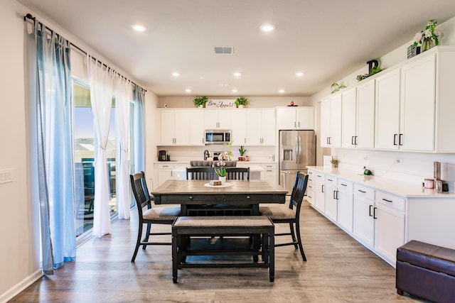 1123 Sugarwood St, Davenport, FL 33837 - dining area with light wood-type flooring and recessed lighting