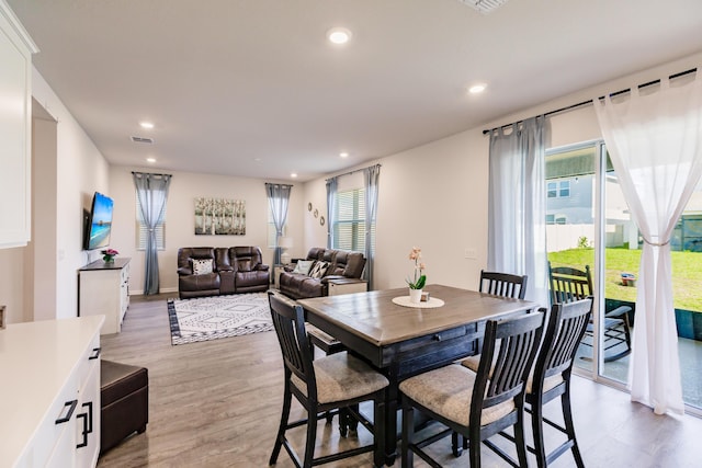 1123 Sugarwood St, Davenport, FL 33837 - dining area with light wood-style flooring and recessed lighting