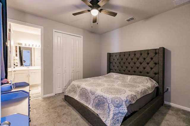1123 Sugarwood St, Davenport, FL 33837 - carpeted bedroom featuring a closet, ceiling fan, and ensuite bath