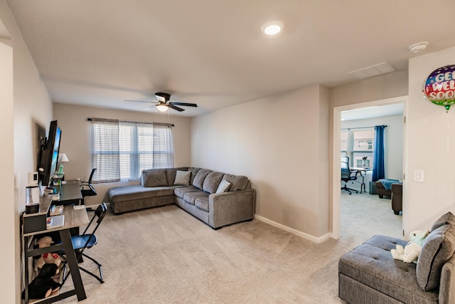 1123 Sugarwood St, Davenport, FL 33837 - living room featuring light colored carpet, ceiling fan, and healthy amount of natural light