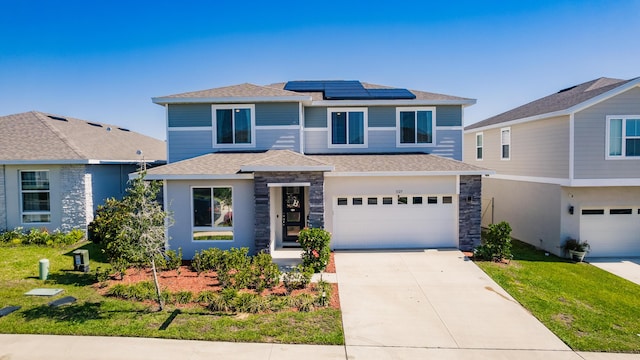 1123 Sugarwood St, Davenport, FL 33837 - view of front facade featuring a garage, roof mounted solar panels, concrete driveway, roof with shingles, and a front yard