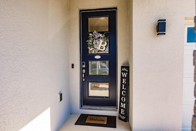 1123 Sugarwood St, Davenport, FL 33837 - property entrance with stucco siding