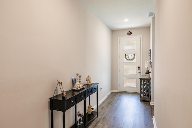 1123 Sugarwood St, Davenport, FL 33837 - foyer with wood finished floors and baseboards