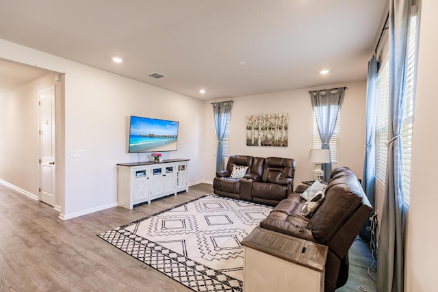 1123 Sugarwood St, Davenport, FL 33837 - living room featuring wood finished floors and recessed lighting