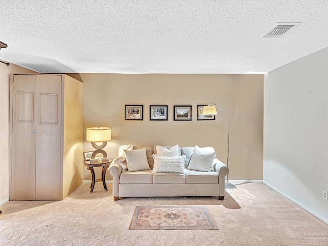 9199 Pecky Cypress Ln Unit 7H, Boca Raton, FL 33428 - carpeted living room with a textured ceiling and baseboards