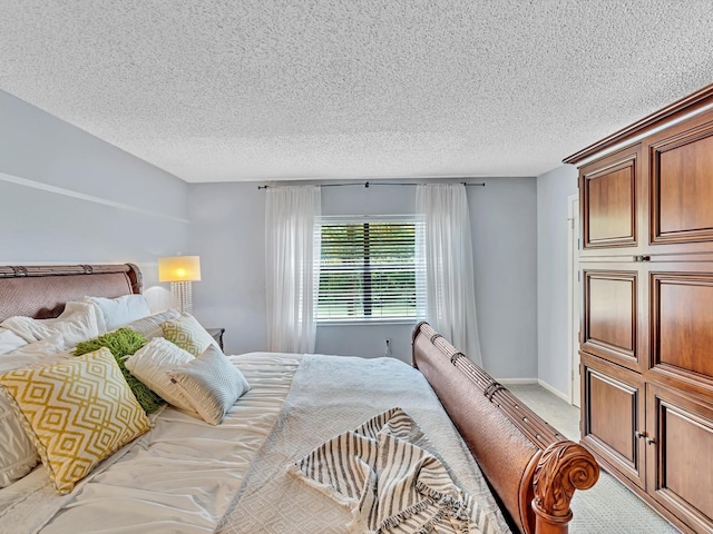 9199 Pecky Cypress Ln Unit 7H, Boca Raton, FL 33428 - bedroom featuring a textured ceiling and light carpet
