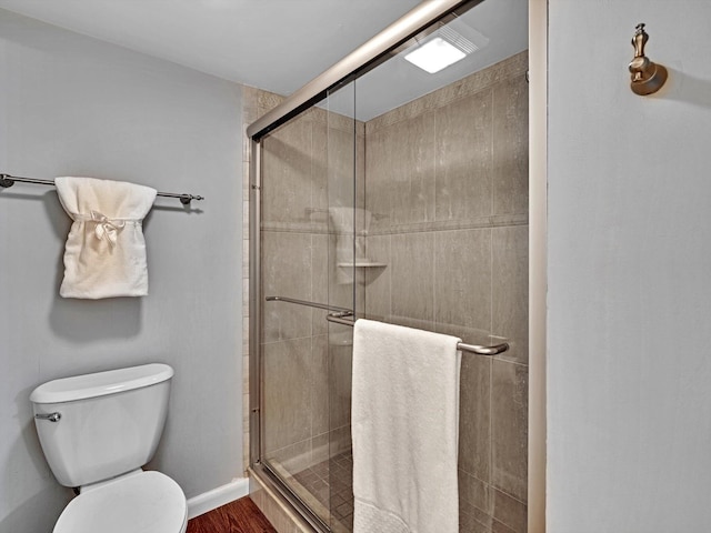 9199 Pecky Cypress Ln Unit 7H, Boca Raton, FL 33428 - bathroom with a stall shower and wood finished floors