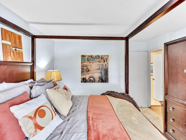 9199 Pecky Cypress Ln Unit 7H, Boca Raton, FL 33428 - bedroom featuring beamed ceiling, carpet, and a textured ceiling