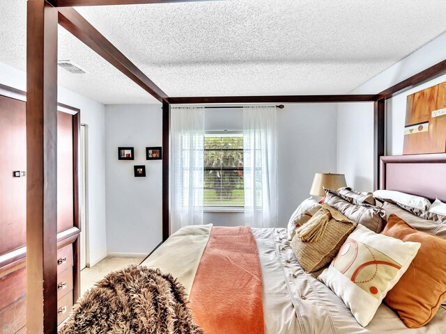 9199 Pecky Cypress Ln Unit 7H, Boca Raton, FL 33428 - bedroom featuring a textured ceiling and carpet