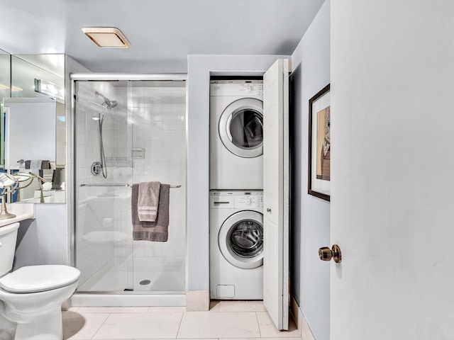 9199 Pecky Cypress Ln Unit 7H, Boca Raton, FL 33428 - bathroom featuring stacked washer / drying machine and a stall shower
