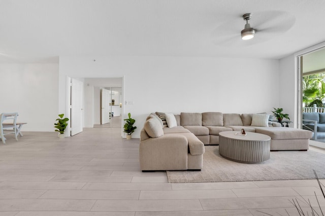120 Ocean Grande Blvd Unit 302, Jupiter, FL 33477 - living room featuring a ceiling fan and light wood-style floors