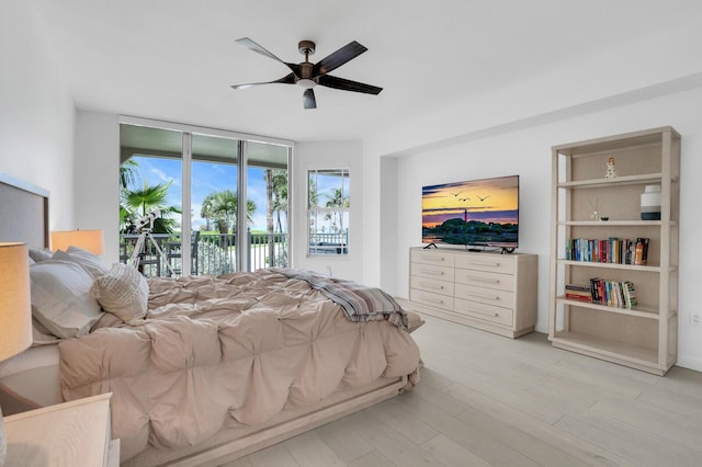120 Ocean Grande Blvd Unit 302, Jupiter, FL 33477 - bedroom featuring access to exterior, light wood finished floors, and a ceiling fan