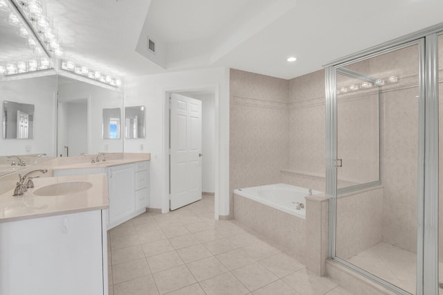 120 Ocean Grande Blvd Unit 302, Jupiter, FL 33477 - bathroom with double vanity, a bath, tile patterned flooring, a stall shower, and recessed lighting