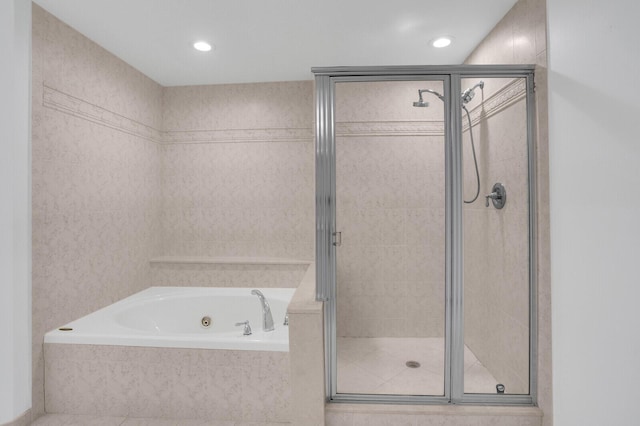 120 Ocean Grande Blvd Unit 302, Jupiter, FL 33477 - bathroom with a whirlpool tub, a stall shower, and recessed lighting