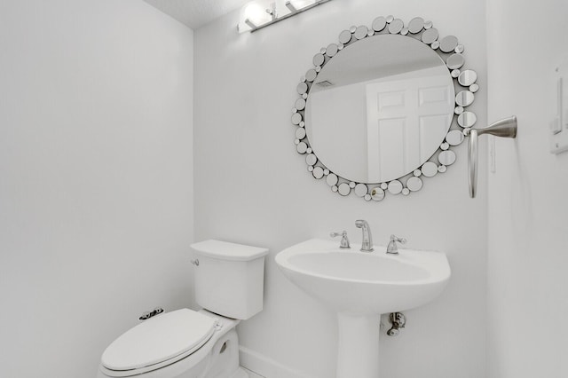 120 Ocean Grande Blvd Unit 302, Jupiter, FL 33477 - half bathroom featuring toilet and baseboards