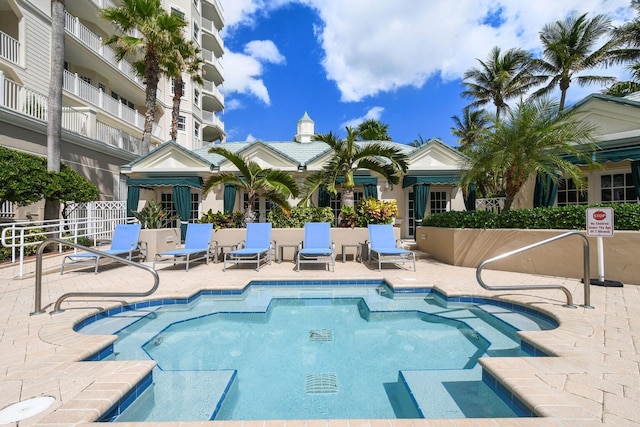 120 Ocean Grande Blvd Unit 302, Jupiter, FL 33477 - view of pool with a swimming pool and a patio