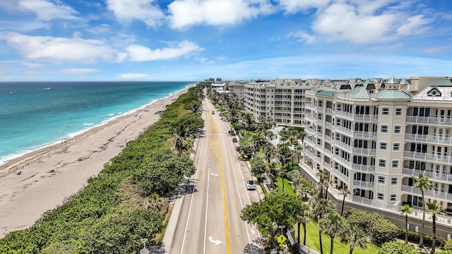 120 Ocean Grande Blvd Unit 302, Jupiter, FL 33477 - drone / aerial view of unending shoreline and apartment complex / building