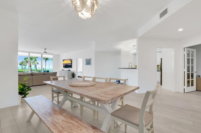 120 Ocean Grande Blvd Unit 302, Jupiter, FL 33477 - dining area featuring a chandelier, recessed lighting, and ceiling fan