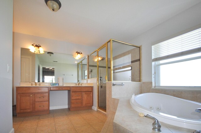 6771 NW Daffodil Ln, Port Saint Lucie, FL 34983 - full bathroom with double vanity, a shower stall, a jetted tub, and tile patterned floors