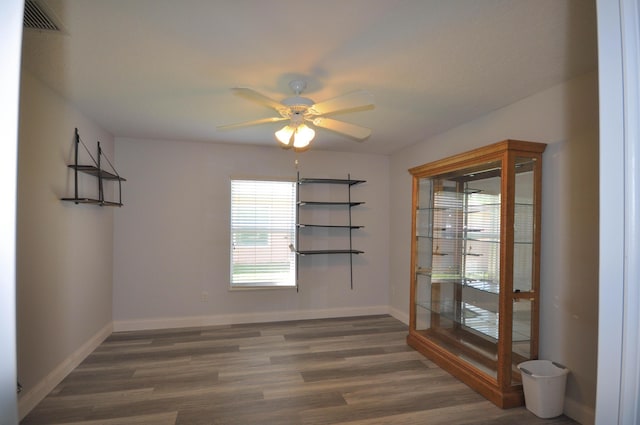 6771 NW Daffodil Ln, Port Saint Lucie, FL 34983 - spare room featuring a ceiling fan and wood finished floors