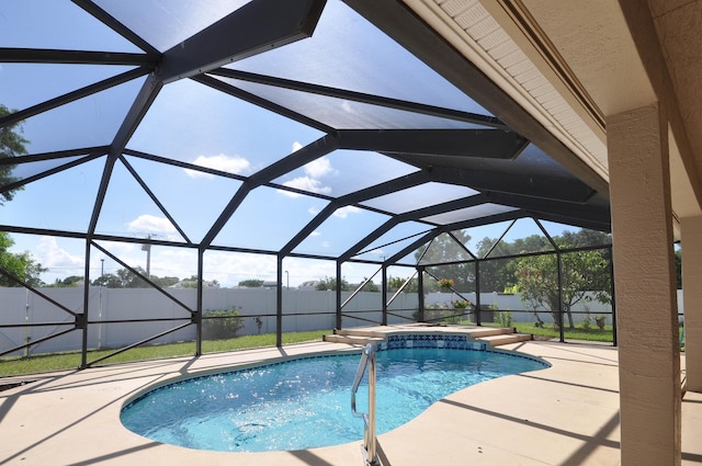6771 NW Daffodil Ln, Port Saint Lucie, FL 34983 - swimming pool with a patio, a fenced backyard, and a lanai