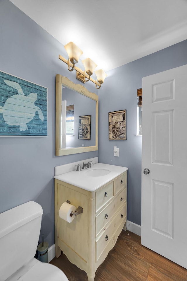 1966 9th St, Vero Beach, FL 32960 - half bathroom with vanity, wood finished floors, and a chandelier