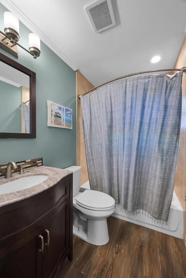1966 9th St, Vero Beach, FL 32960 - full bath with vanity, wood finished floors, shower / tub combo with curtain, and crown molding