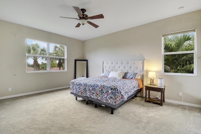 244 Behring Way, Jupiter, FL 33458 - carpeted bedroom with multiple windows and ceiling fan