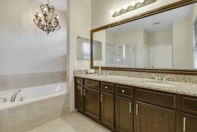 244 Behring Way, Jupiter, FL 33458 - full bathroom with a stall shower, tile patterned flooring, double vanity, a bath, and a chandelier