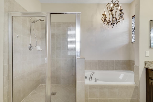 244 Behring Way, Jupiter, FL 33458 - bathroom featuring vanity, a garden tub, a stall shower, and a chandelier