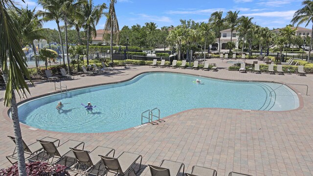 244 Behring Way, Jupiter, FL 33458 - community pool with a patio