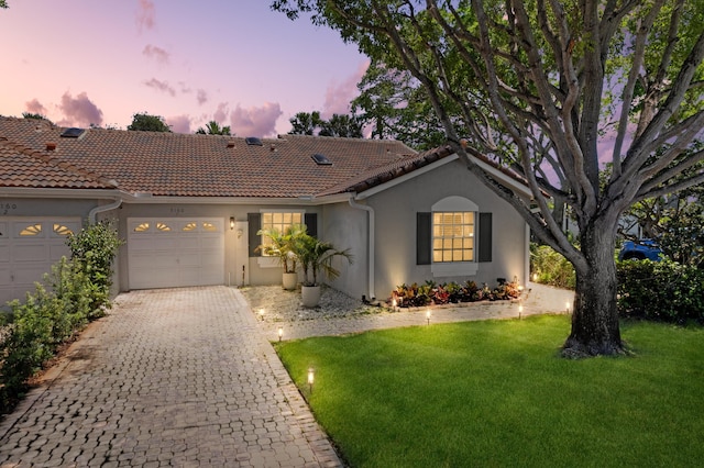 5160 Sabal Gardens Ln Unit 1, Boca Raton, FL 33487 - view of front of home featuring an attached garage, stucco siding, a lawn, decorative driveway, and a tiled roof