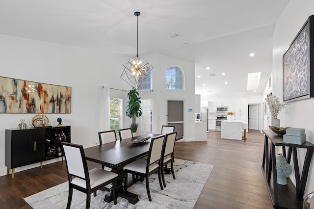 5160 Sabal Gardens Ln Unit 1, Boca Raton, FL 33487 - dining space with dark wood-style flooring, a chandelier, a high ceiling, recessed lighting, and a skylight
