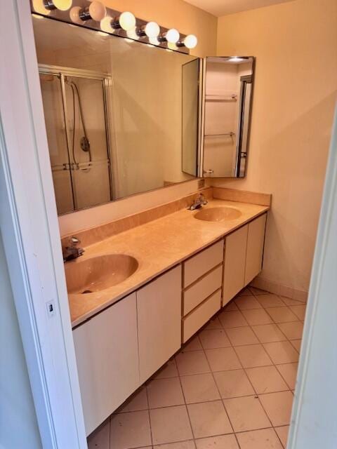 217 Live Oak Ln, Boynton Beach, FL 33436 - bathroom with double vanity, a stall shower, and tile patterned flooring