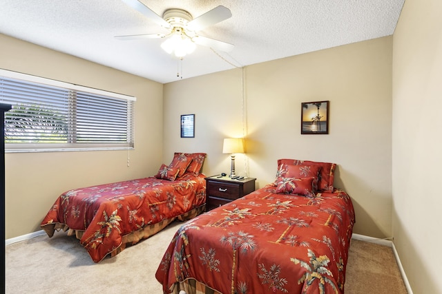 2600 NE 1st Ln Unit 3110, Boynton Beach, FL 33435 - carpeted bedroom featuring a textured ceiling and a ceiling fan
