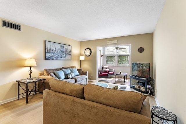 2600 NE 1st Ln Unit 3110, Boynton Beach, FL 33435 - living room with baseboards and light wood-style flooring