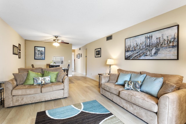 2600 NE 1st Ln Unit 3110, Boynton Beach, FL 33435 - living room with light wood-style floors and ceiling fan