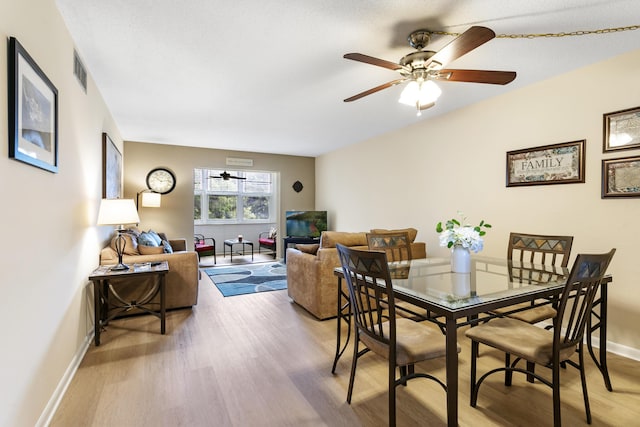 2600 NE 1st Ln Unit 3110, Boynton Beach, FL 33435 - dining space featuring wood finished floors and a ceiling fan