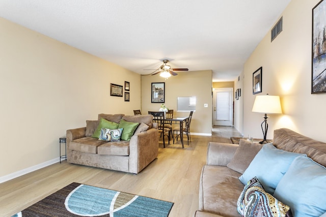 2600 NE 1st Ln Unit 3110, Boynton Beach, FL 33435 - living area featuring a ceiling fan and light wood-style floors