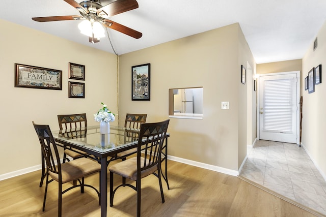 2600 NE 1st Ln Unit 3110, Boynton Beach, FL 33435 - dining space with ceiling fan and light wood-style flooring