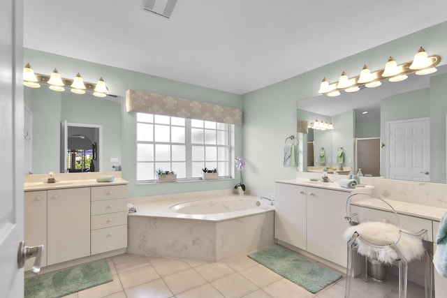 12388 Lakeridge Falls Dr, Boynton Beach, FL 33437 - full bath featuring a garden tub, two vanities, tile patterned flooring, and an enclosed shower