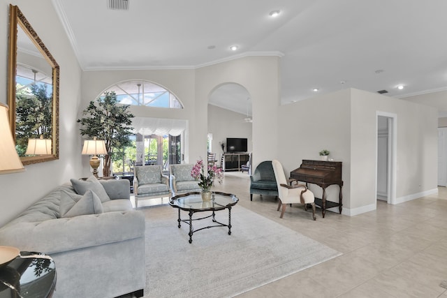 12388 Lakeridge Falls Dr, Boynton Beach, FL 33437 - living room featuring crown molding, arched walkways, light tile patterned floors, and high vaulted ceiling