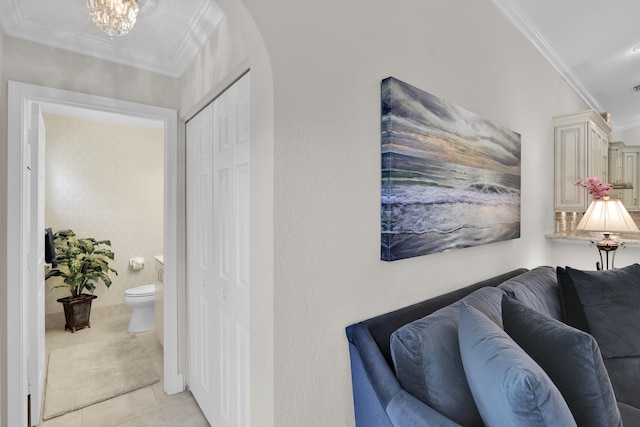 12388 Lakeridge Falls Dr, Boynton Beach, FL 33437 - hall featuring crown molding, light tile patterned flooring, and arched walkways