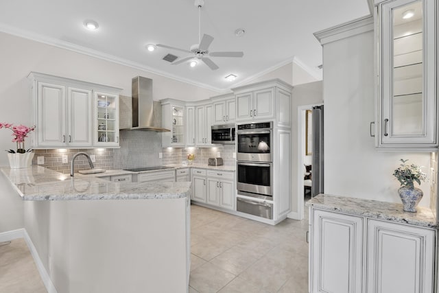 12388 Lakeridge Falls Dr, Boynton Beach, FL 33437 - kitchen featuring wall chimney range hood, stainless steel appliances, ornamental molding, decorative backsplash, and a warming drawer
