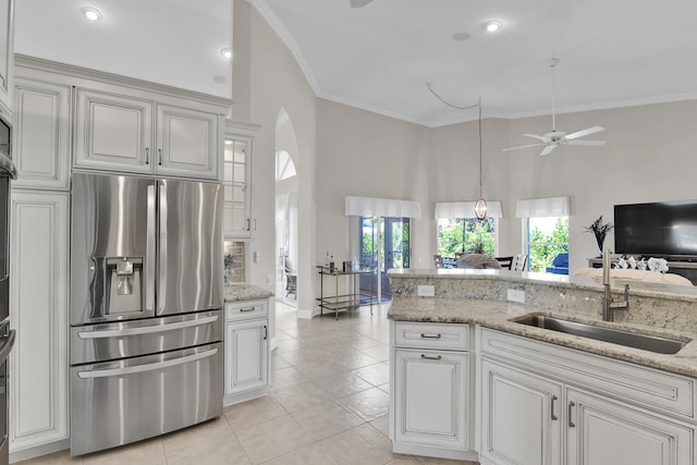 12388 Lakeridge Falls Dr, Boynton Beach, FL 33437 - kitchen with stainless steel fridge, a towering ceiling, a ceiling fan, light tile patterned floors, and ornamental molding